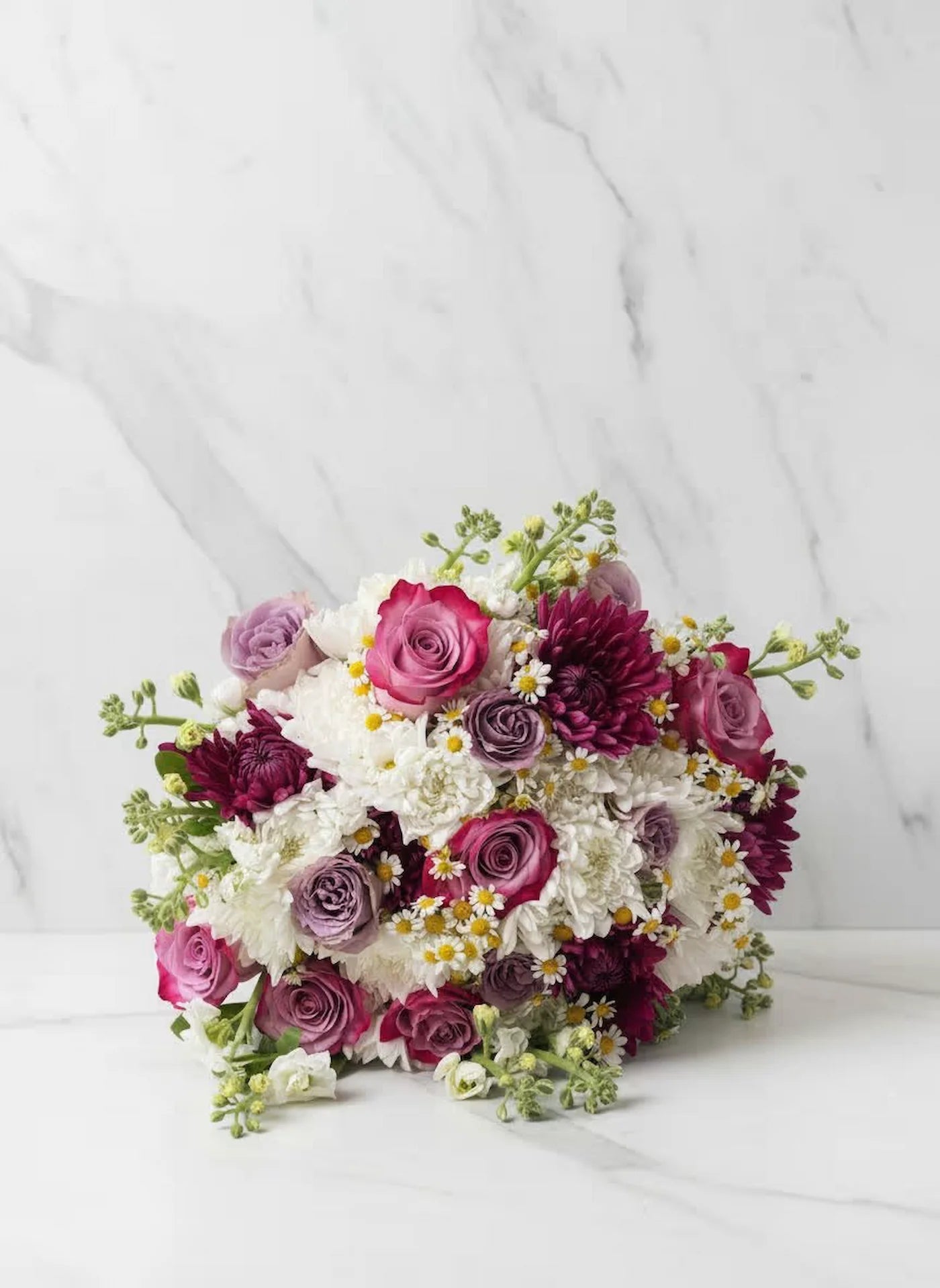 Bouquet of pink, white, and purple flowers on a white background