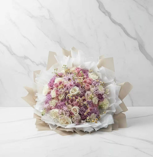 Bouquet of flowers wrapped in paper on a white background
